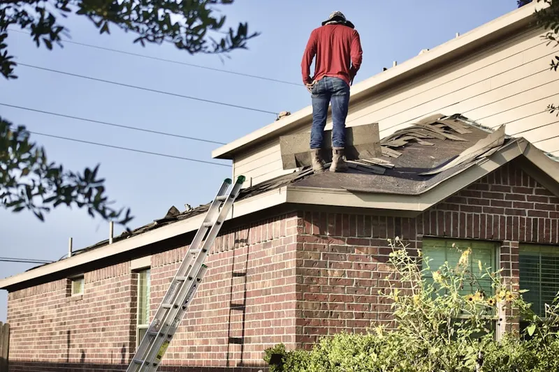 Professional roofer working on a residential roof in Tahoe City